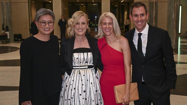 Penny Wong, Katy Gallagher and Treasurer Jim Chalmers and wife Laura Anderson arriving at the Midwinter Ball. Picture: NCA NewsWire / Martin Ollman