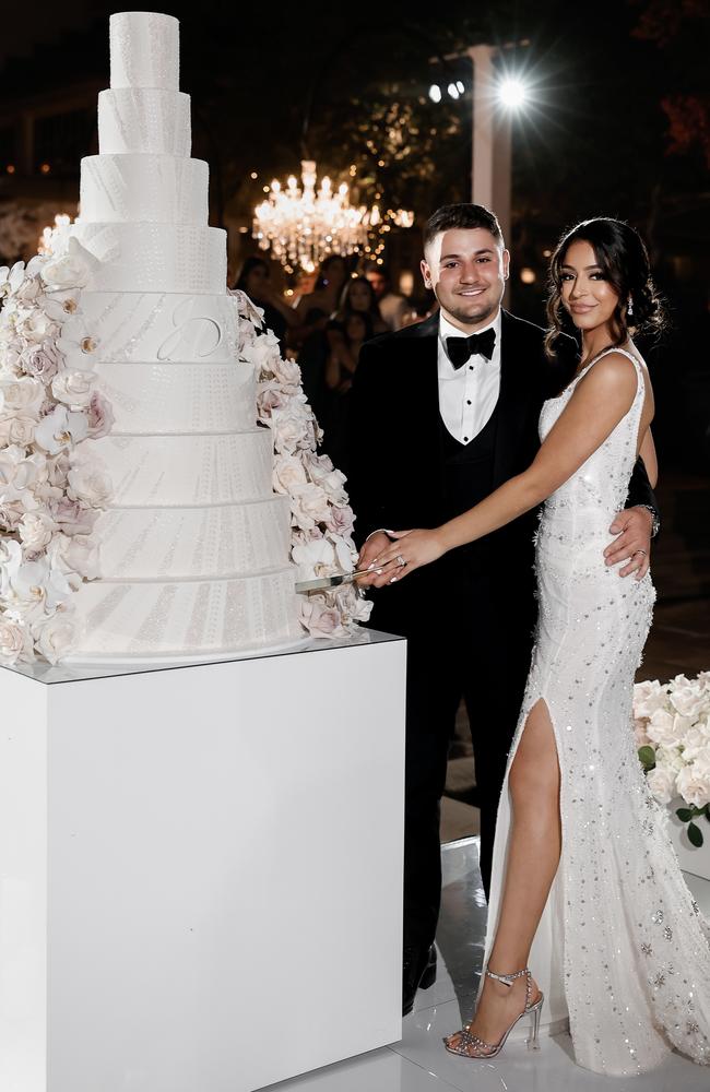 Julian and Daniella cut their nine-tier wedding cake. Picture: Ariana Photography.