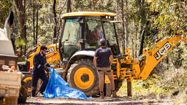 An excavator is brought onto the site where police searched for the remains of missing campers Russell Hill and Carol Clay. Picture: NCA