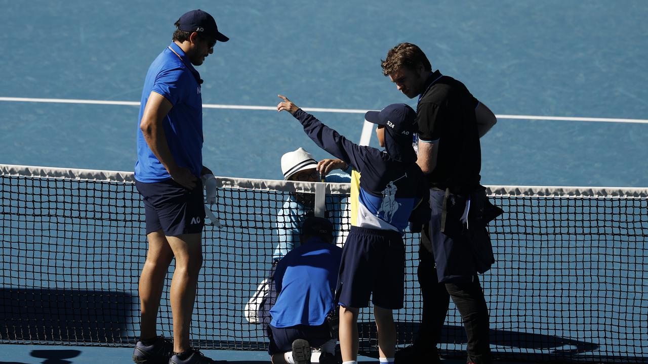 Technical staff examine the net camera after Medvedev took it out. Picture: Daniel Pockett/Getty Images