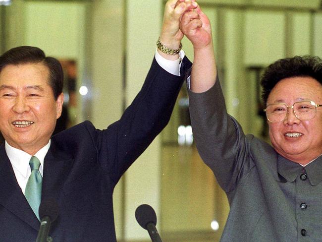 FILE - In this June 14, 2000 file photo, North Korean leader Kim Jong Il, right, and South Korean President Kim Dae-jung raise their arms together before signing a joint declaration at the end of the second day of a three-day summit in Pyongyang. Seven months ahead of the Pyeongchang Olympics, many in South Korea, including new liberal President Moon Jae-in, hope to use the Games as a venue to promote peace with rival North Korea. To do so, the Northâ€™s participation is essential, but an ongoing nuclear tension and a lack of winter sports athletes in North Korea could ruin the attempts at reconciliation. (Yonhap via AP, File)