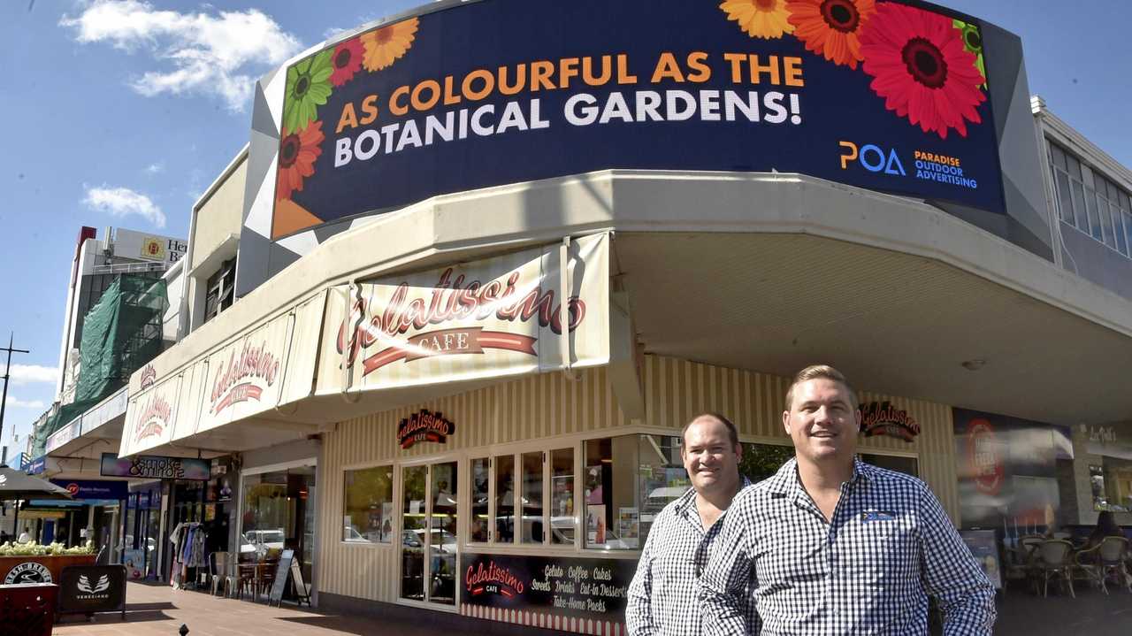 LIGHT IT UP: Anthony Baxter Development Officer (left) and Mitch James CEO Paradise Outdoor Adverting at the launch of a new electronic billboard in the CBD. Picture: Bev Lacey