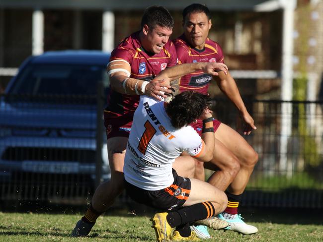 Daniel Payne on the end of a big hit. Picture Warren Gannon Photography