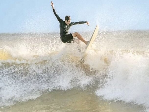 Preslie Smith surfing