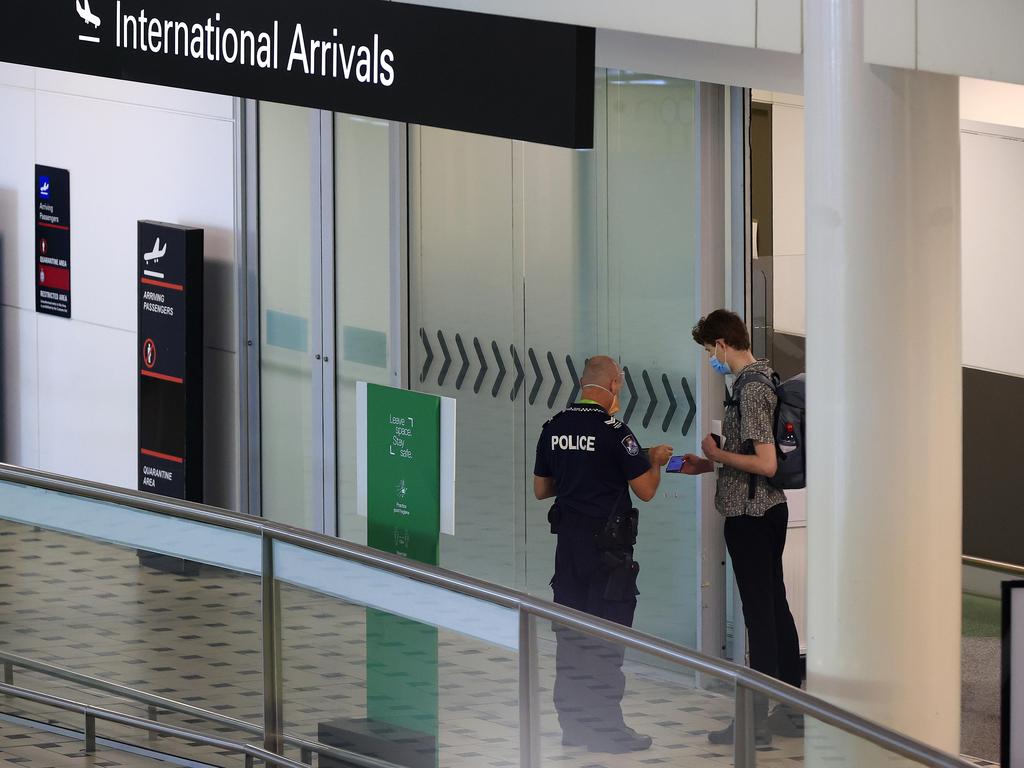 Passengers arrive at Brisbane International Airport on a flight from Singapore. Picture: Adam Head