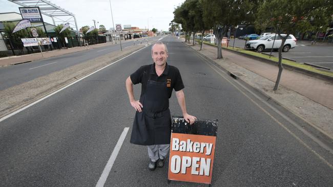 The Village Baker owner Ben Sachse standing on an empty South Rd. Picture: Tait Schmaal.