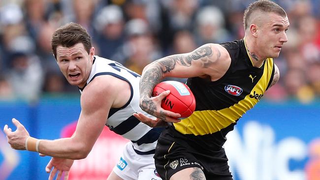 Dustin Martin escapes from Patrick Dangerfield earlier this year.