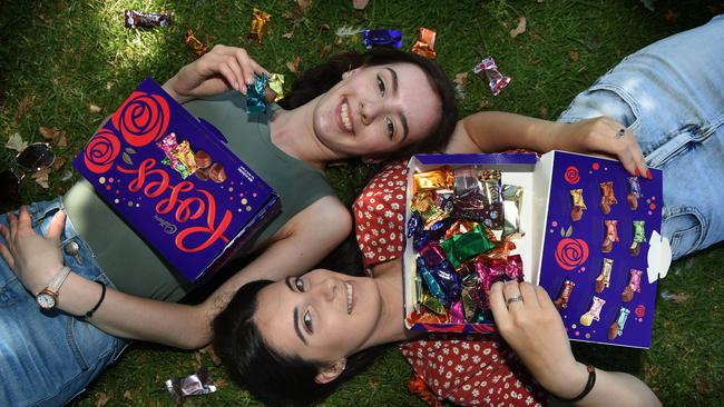 Evie Filippis and Dunk Hassakis try out the new flavours in the Cadbury Roses chocolates box. Picture: Tony Gough