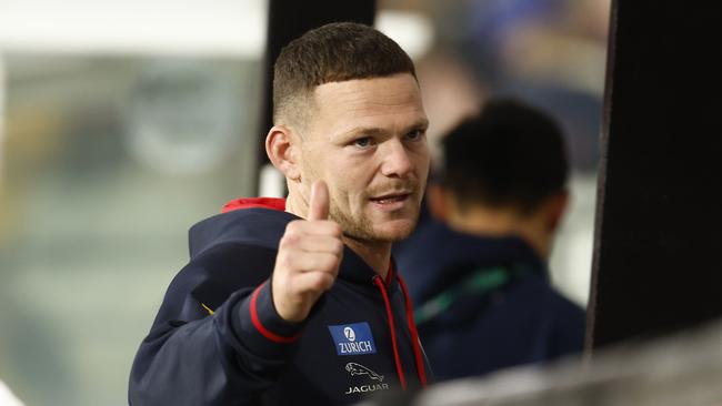 Steven May gives the thumbs up on the interchange bench after being ruled out with concussion. He will miss next week’s clash against Sydney. Picture: Darrian Traynor/Getty Images