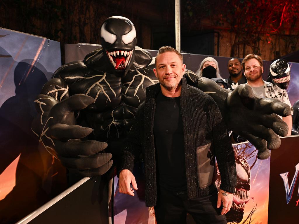 Behind you! Tom Hardy seems blissfully unaware of the trouble lurking behind him. Picture: Kate Green/Getty Images