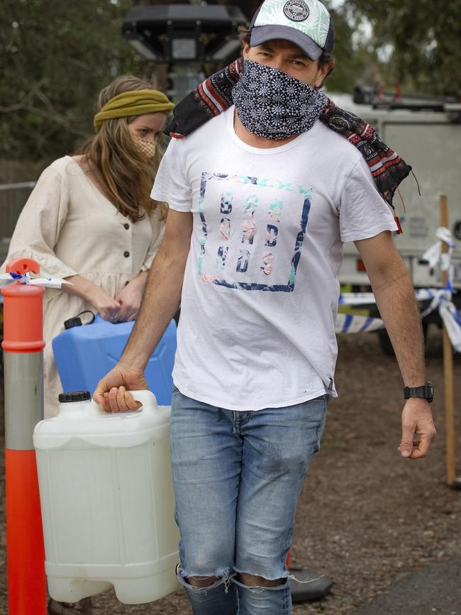 Residents were forced to bring their own containers to fill up. Picture: Sarah Matray