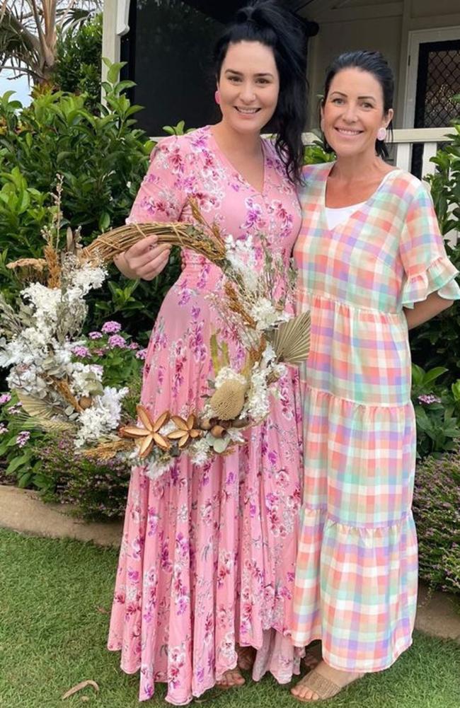 Little Cottage Blooms owner, Kate Brignull (R) pictured with her good friend Teeana Mangin (L), holding a creation made in a florist's wreath workshop.