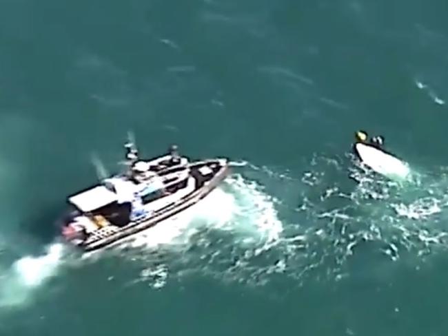 Police at the scene of a boat capsize off the Brisbane coast that sadly led to the death of two men. Picture: Seven News Brisbane