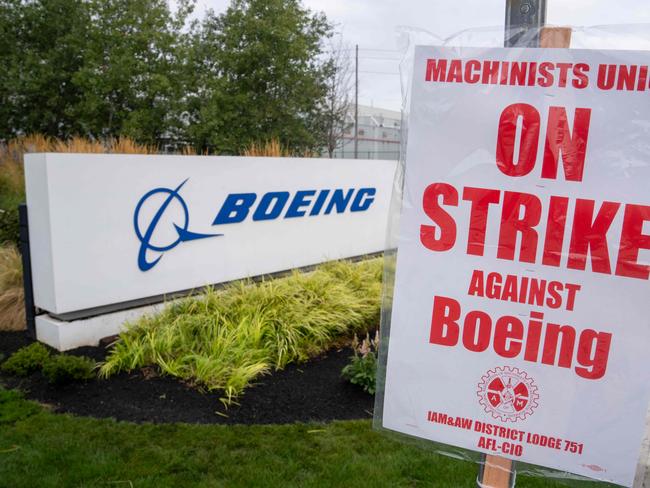 A strike sign is pictured outside a Boeing factory on September 13, 2024 in Renton, Washington. Boeing announced October 11, 2024 that it plans to cut 10 percent of its workforce as it projected a large third-quarter loss in the wake of a machinist strike in the Seattle region. (Photo by STEPHEN BRASHEAR / GETTY IMAGES NORTH AMERICA / AFP)