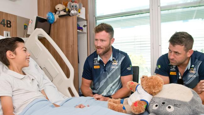 Josh Hannay and Gavin Cooper at a hospital visit with Jayden Jackson, 10. Picture: Emma Murray