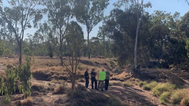 Queensland Police search a dry creek in Reward, near Rubyvale, where Mr Foley’s human remains were found. Picture: QPS