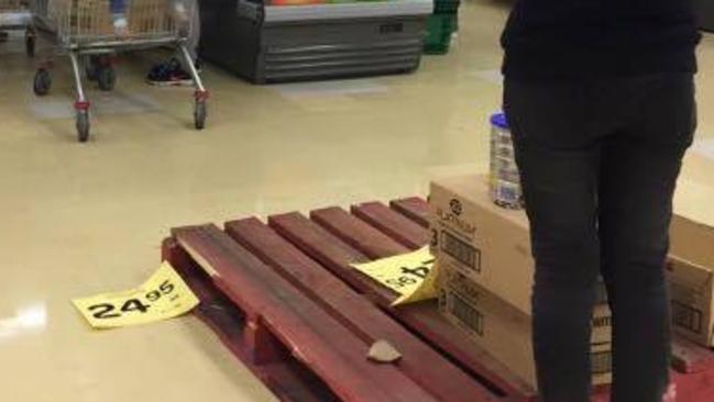 The empty pallet after four shoppers cleared the baby formula stock.