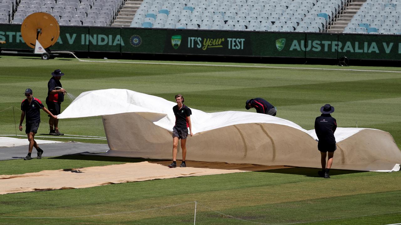 MCG curator staff prepare the pitch for the Boxing Day Test.