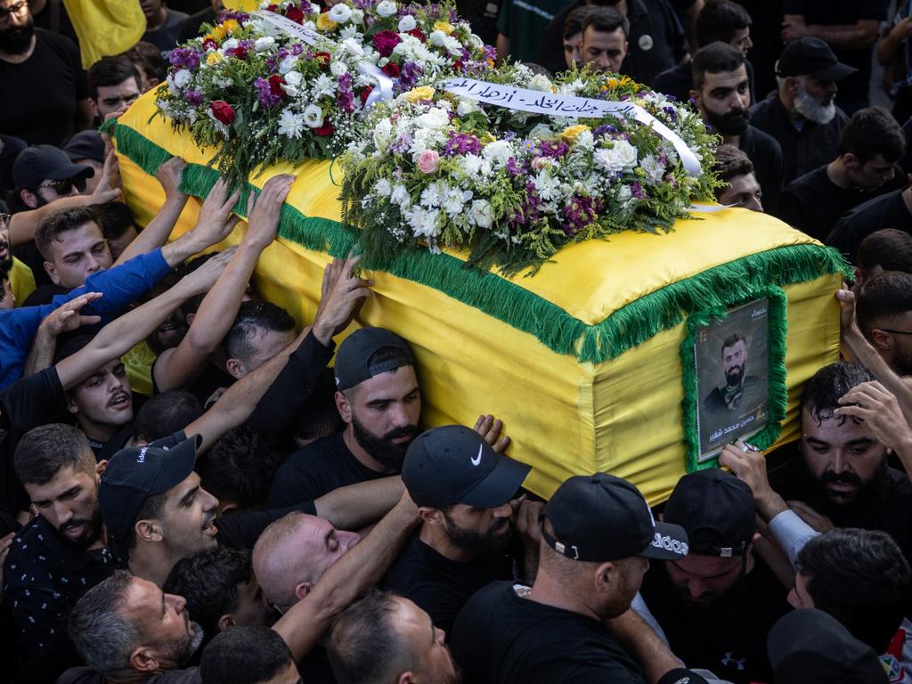 Men carry the coffin of Hezbollah fighter Husein Mohamad Choukair who was killed in an Israeli drone strike in southern Lebanon on August 23, during his funeral on August 24. Picture: Chris McGrath/Getty Images