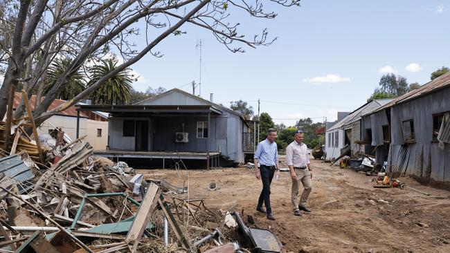 NSW Premier Dominic Perrottet and Orange MP Philip Donato walk through flood damaged businesses in Eugowra. Picture: Getty Images