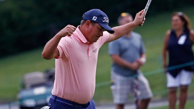 Jason Dufner reacts after making a par on the 18th hole during the final round.