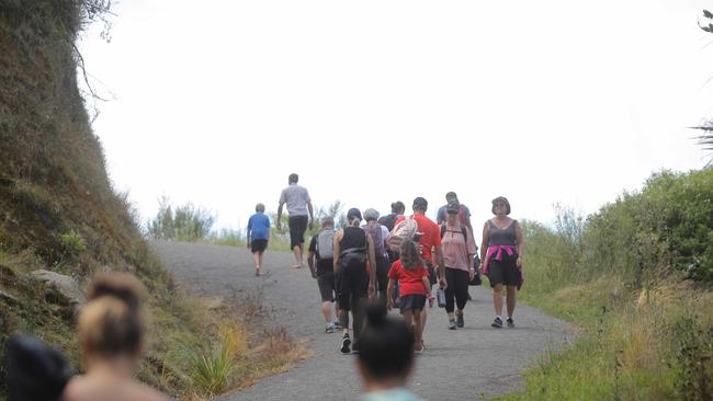 Residents of the Bay of Plenty on the North Island’s east coast climb to higher ground. Picture: George Novak.