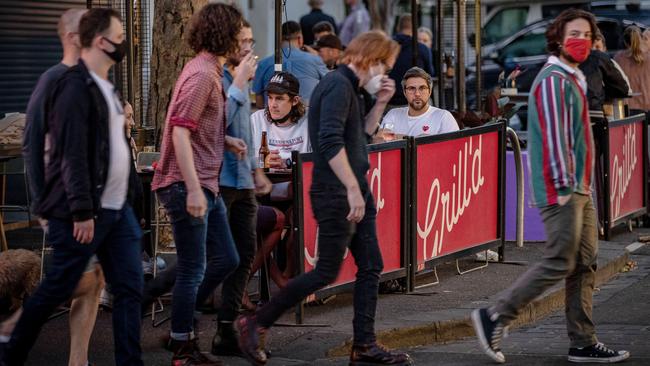 People enjoy outdoor eating on Swan St in Richmond as lockdown restrictions lift. Picture: Getty Images