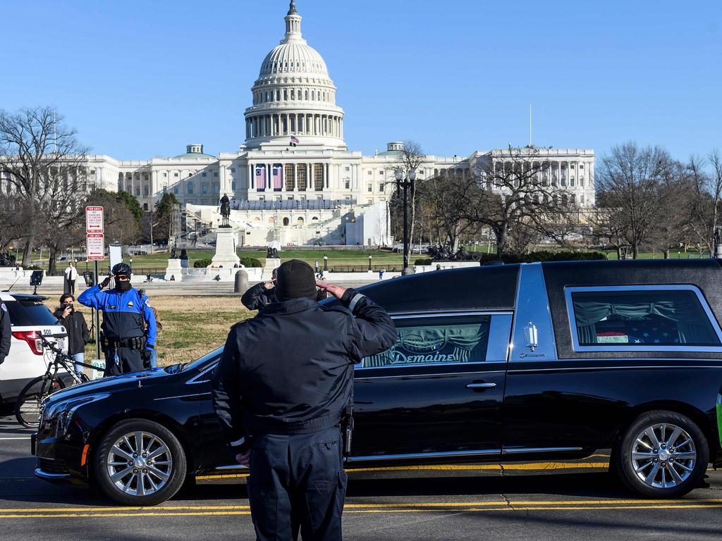 US Capital police stand at attention as the casket with fallen police officer, Brian Sicknick, passes during a funeral procession in Washington, DC. Picture: AFP