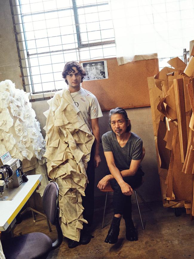 Designers and collaborators Akira Isogawa, sitting, and Jordan Gogos, in Isogawa’s Sydney studio. Picture: James Tolich for Vogue Australia