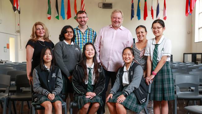 Richard White and James Curran of Grok Academy with Auburn Girls High principal Anna Tsoutsa and students who are set to benefit from WiseTech’s investment in education. Picture: Justin Lloyd