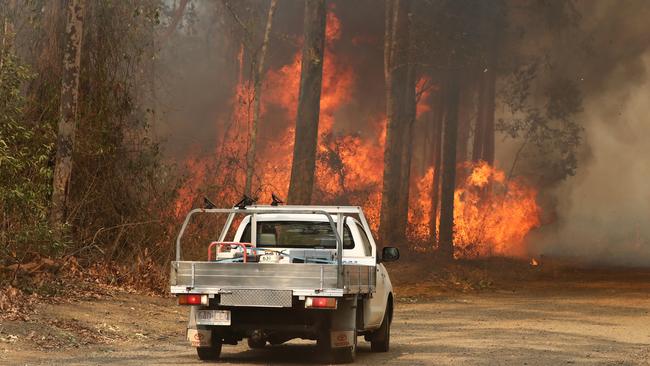 Residents near a bushfire burning next to Busby's Flat. Picture: AAP/Jason O'Brien