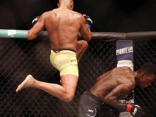 Anderson Silva attempts a flying knee. 