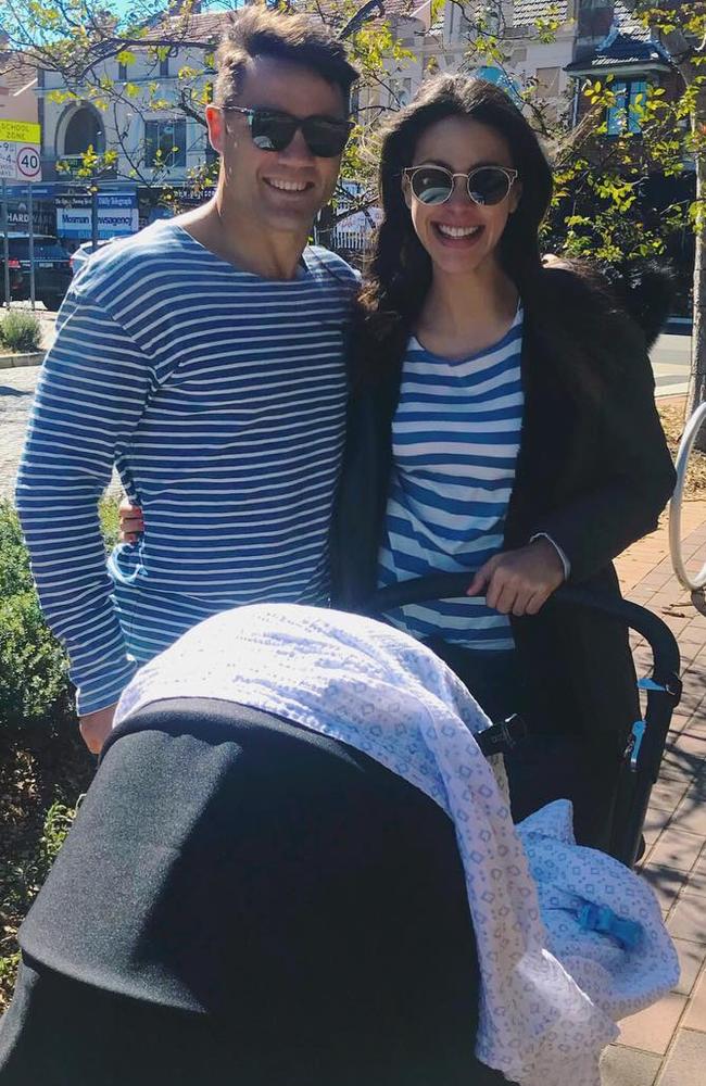 Cronk and wife Tara Rushton take son Lennox for a walk.