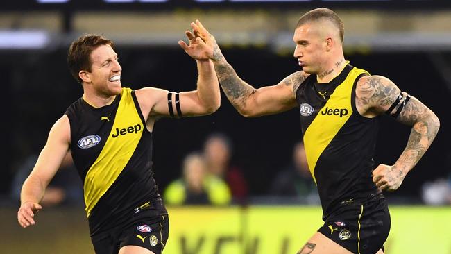 MELBOURNE, AUSTRALIA - SEPTEMBER 06: Dustin Martin of the Tigers is congratulated by Reece Conca after kicking a goal during the AFL First Qualifying Final match between the Richmond Tigers and the Hawthorn Hawks at Melbourne Cricket Ground on September 6, 2018 in Melbourne, Australia. (Photo by Quinn Rooney/Getty Images)