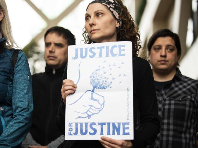 Jenelle Masterson holds a sign reading Justice for Justine. Picture: Getty