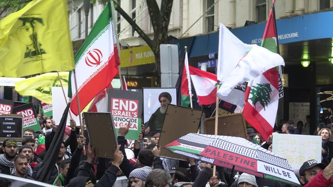 A man has been charged after allegedly displaying the flag of terrorist organisation Hezbollah at a city rally. Picture: NCA NewsWire