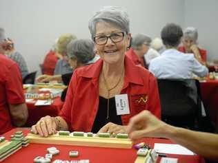 TILES STYLE: Lyn Nugent (name badge incorrectly spelled) at Rockhampton Mahjong challenge. Picture: Jann Houley