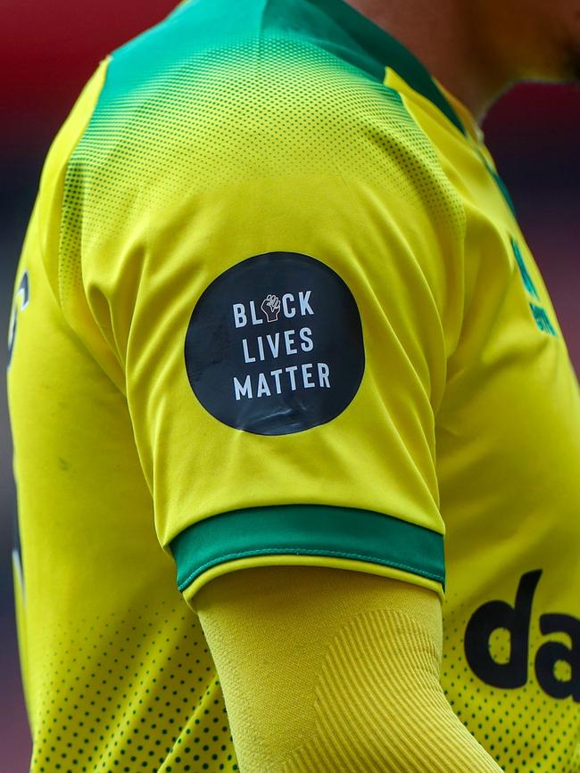 A Black Lives Matter badge is seen on the jersey of a Norwich player during the English Premier League football match against Arsenal overnight. Picture: AFP