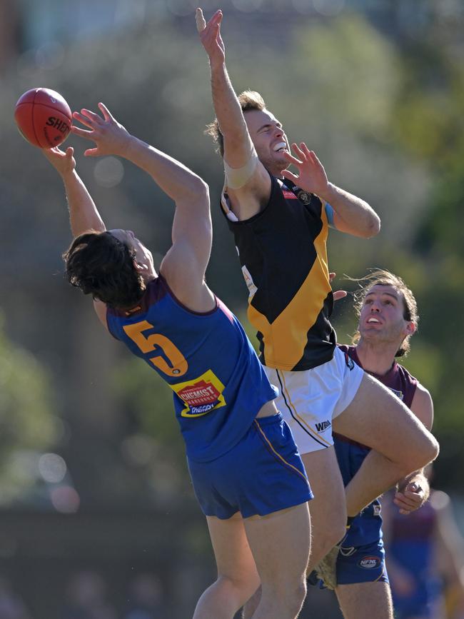 NFNL: Banyule’s Nick Biscontin marks against Zane Barzen of Heidelberg. Picture: Andy Brownbill