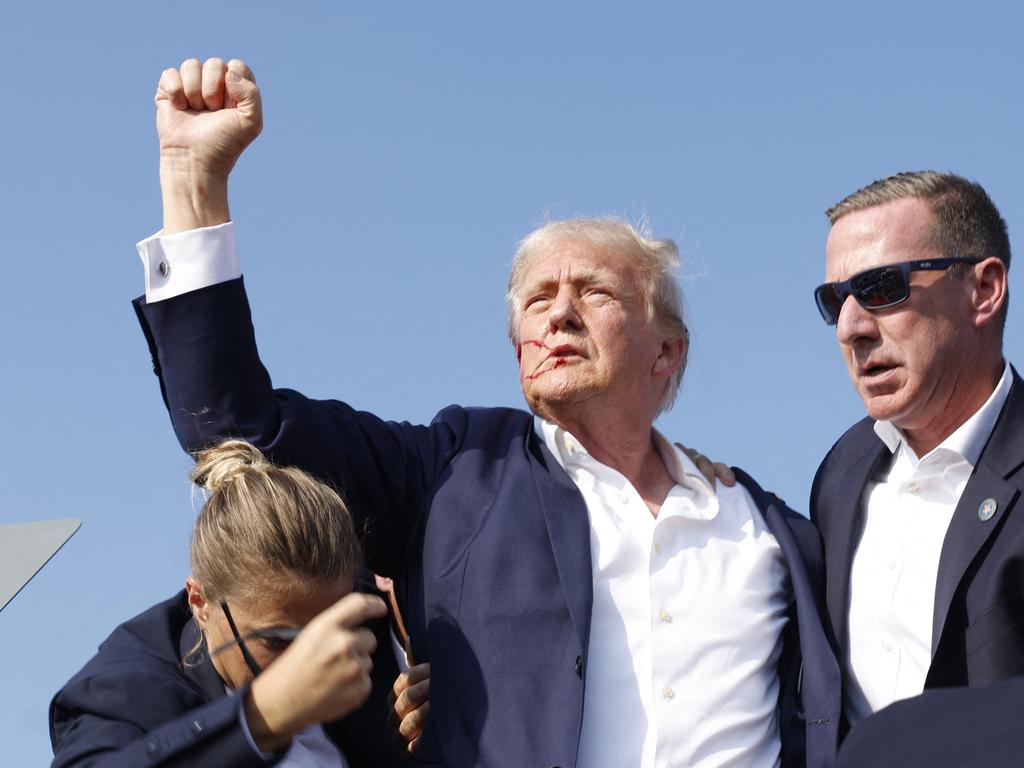 The instantly iconic image of a defiant Donald Trump after he was shot at. Picture: Getty Images