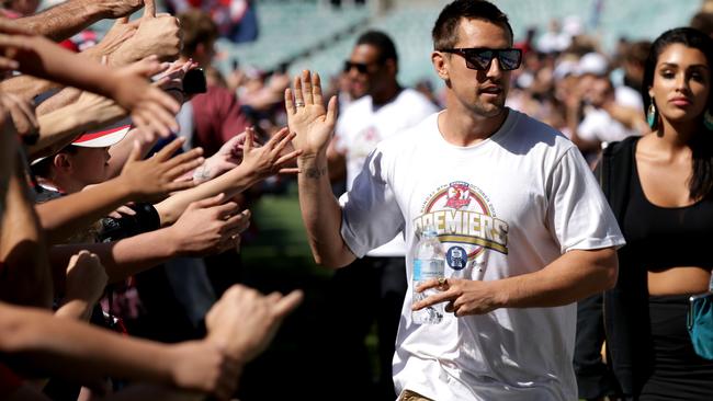 Pearce celebrating the Roosters’ 2013 premiership triumph with fans. Photo: Gregg Porteous