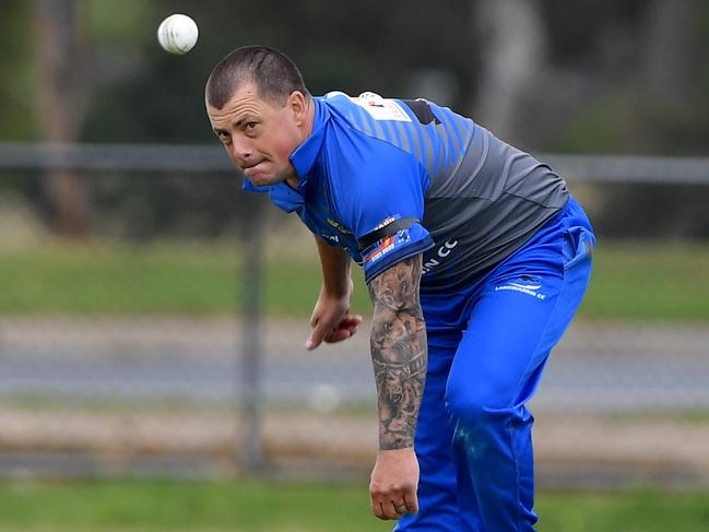 Travis Campbell sends one down for Langwarrin. Picture: Andy Brownbill