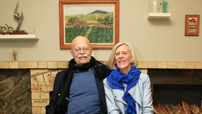 Charles and Pip Woodward at the Rainforestation 40th year celebrations in 2016 sitting in front of the original opening plaque and fireplace that had been opened by former Queensland premier Sir Joh Bjelke-Petersen in 1976. Picture: Justin Brierty