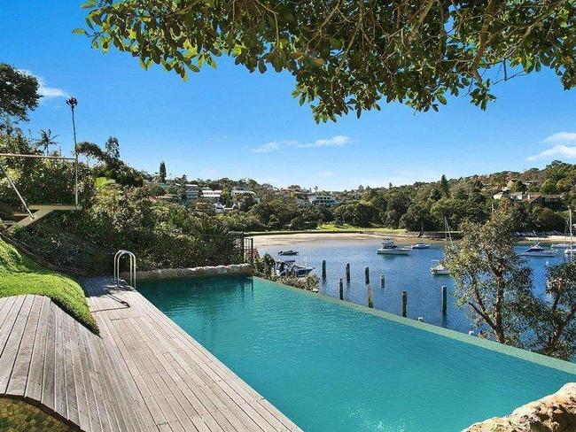 An infinity pool overlooks sparkling Sirius Cove.