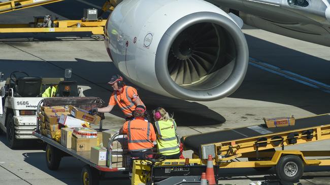 Baggage handlers load a Qantas aircraft at Sydney Airport. Picture: Supplied