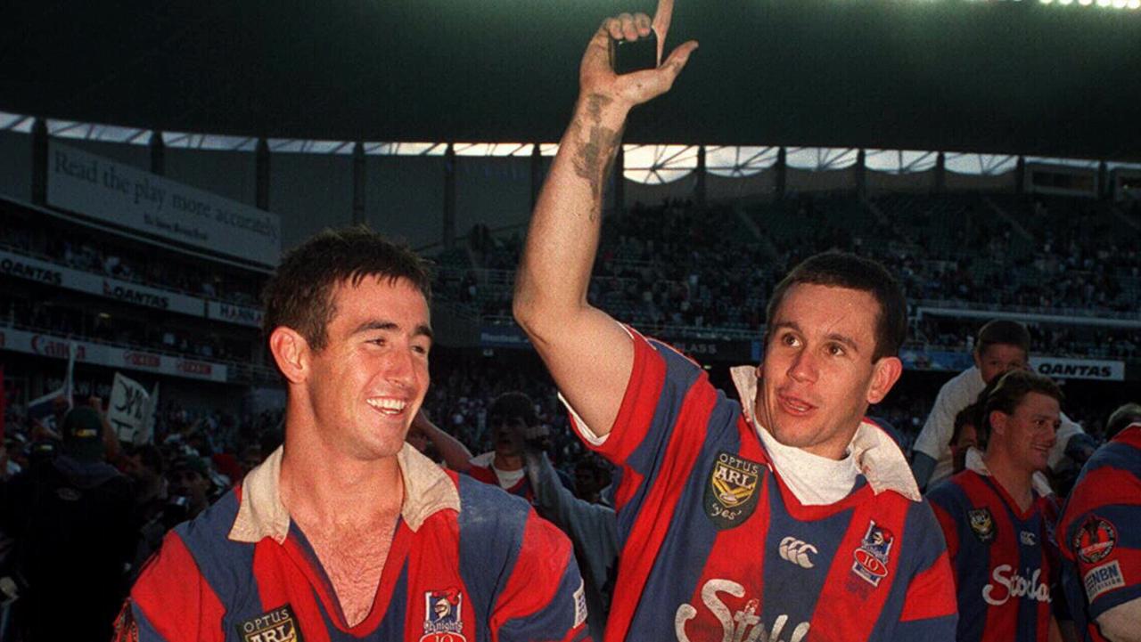 Brothers Andrew (left) and Matthew Johns do lap of honour after Newcastle Knights defeated Manly in 1997 ARL grand final 