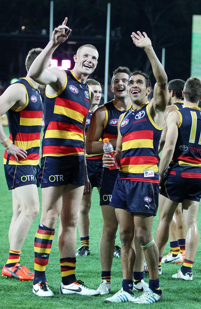 Sam Jacobs and Eddie Betts wave to the crowd after a win. Photo: Sarah Reed.