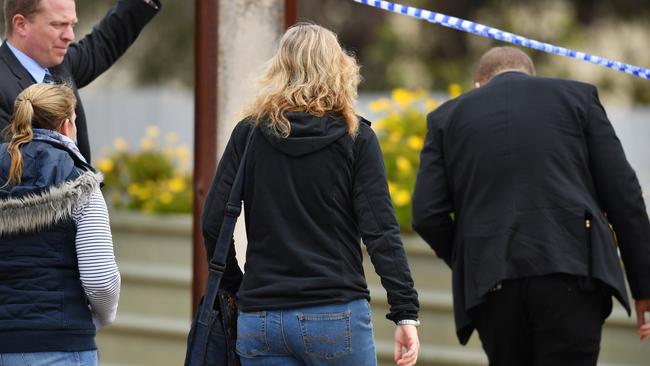 The daughter of Colleen Adams enters the Maitland property where what police believe are the remains of her mother have been found after 45 years. Picture: AAP / David Mariuz