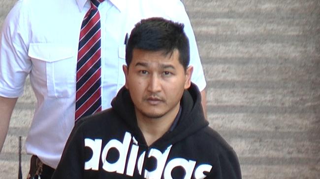 Hamzeh Bahrami shortly after being arrested for sexually assaulting a 10-year-old girl in a Blair Athol toilet block Photo: Nine News