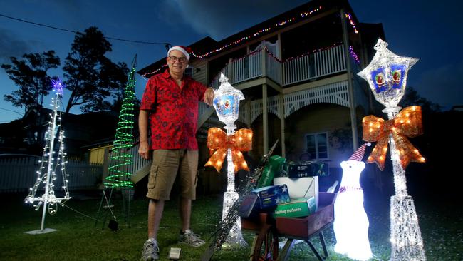 Peter Boddy at his Bulimba home says power prices have made him change his display. Picture: AAP Image/Steve Pohlner